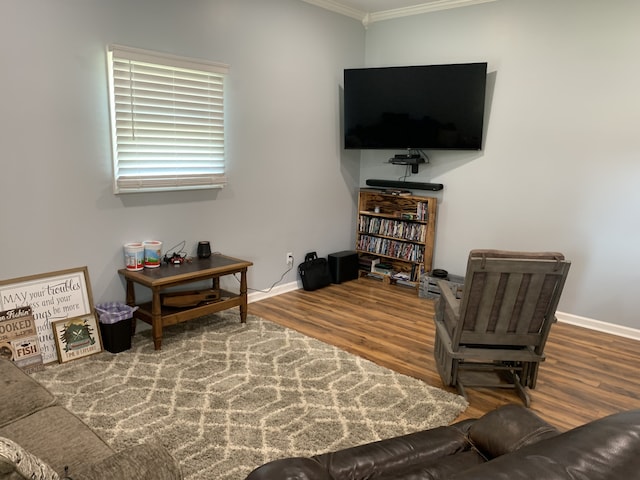 living room with ornamental molding and hardwood / wood-style flooring