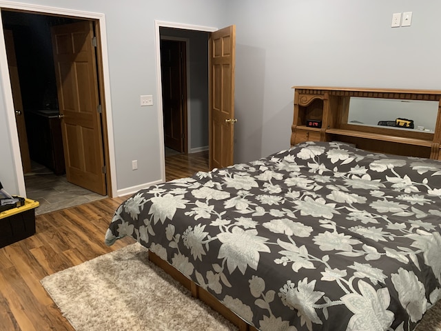 bedroom with hardwood / wood-style floors