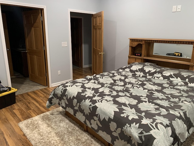 2175 Winsett Rd, Springville, TN 38256 - bedroom featuring baseboards and wood finished floors