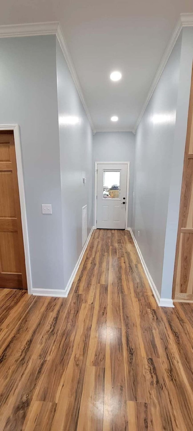 2175 Winsett Rd, Springville, TN 38256 - hallway with baseboards, ornamental molding, wood finished floors, and visible vents
