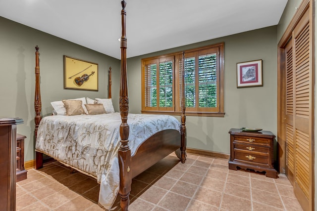 tiled bedroom with a closet