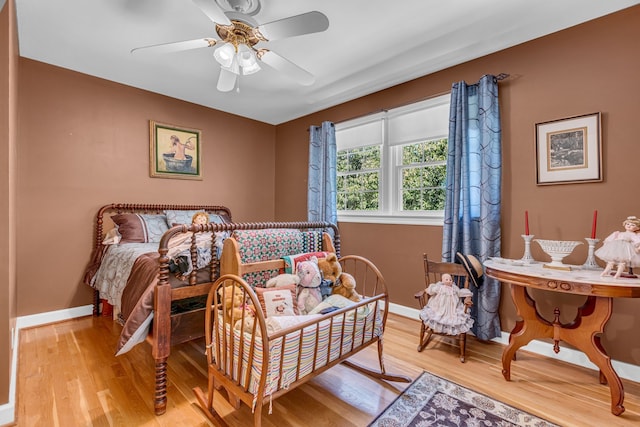 bedroom with wood-type flooring and ceiling fan