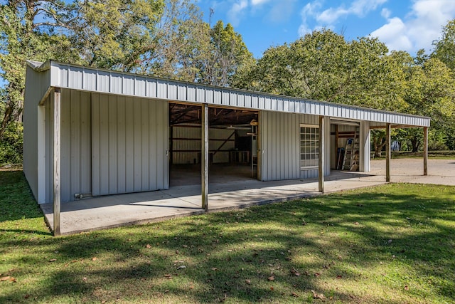 view of outbuilding with a yard