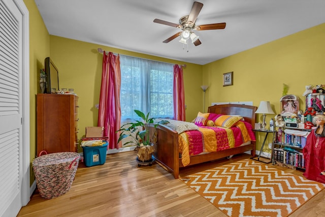 bedroom featuring light wood-type flooring and ceiling fan