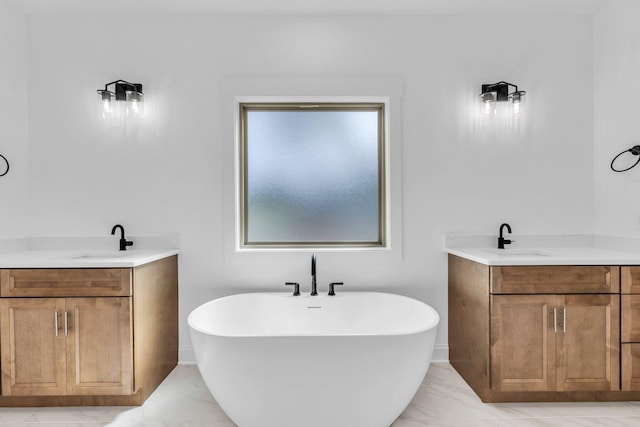 405 Boone Pass, Jasper, TN 37347 - full bathroom with two vanities, marble finish floors, and a freestanding bath
