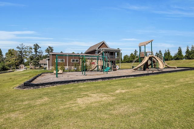 view of playground with a lawn