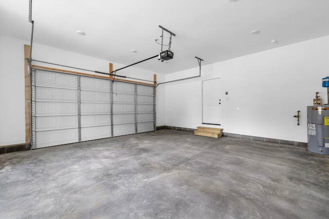 garage with a garage door opener and water heater