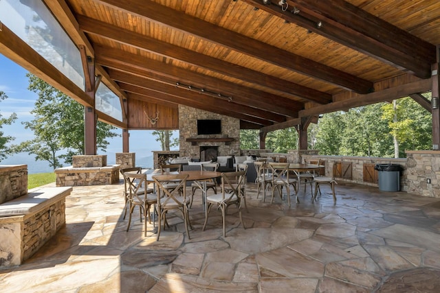 405 Boone Pass, Jasper, TN 37347 - view of patio / terrace with an outdoor stone fireplace and outdoor dining space