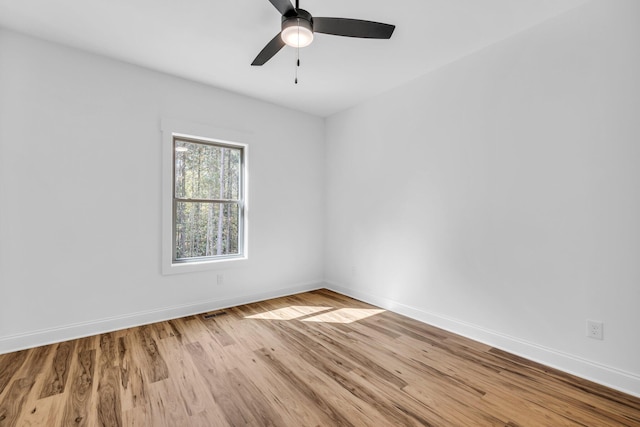 spare room with ceiling fan and light hardwood / wood-style floors