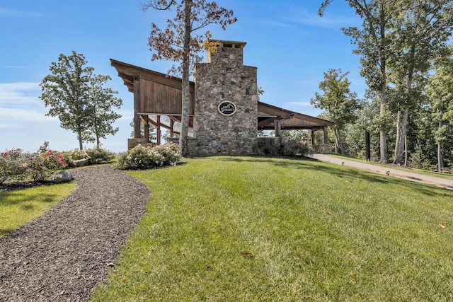 405 Boone Pass, Jasper, TN 37347 - back of property with a chimney and a lawn