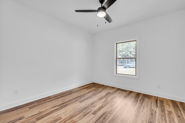 empty room with light hardwood / wood-style flooring and ceiling fan