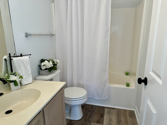 full bathroom with wood-type flooring, toilet, vanity, and shower / bath combo