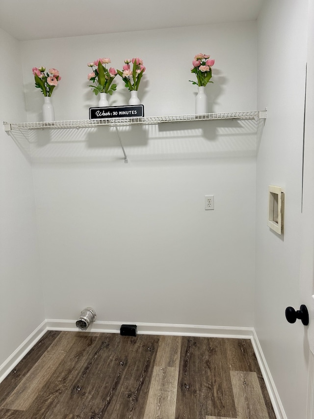 laundry room with dark wood-type flooring and hookup for a washing machine