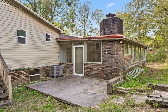 back of property featuring a patio and cooling unit