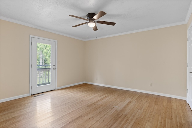 unfurnished room with light hardwood / wood-style floors, ornamental molding, a textured ceiling, and ceiling fan