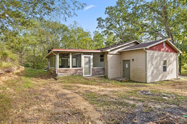 view of front of home with a sunroom