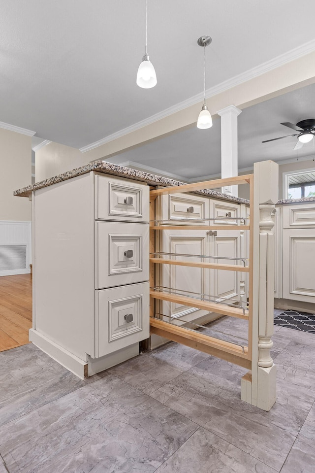 basement featuring light hardwood / wood-style floors, ornamental molding, and ceiling fan