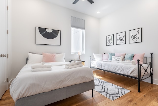 bedroom featuring hardwood / wood-style flooring and ceiling fan