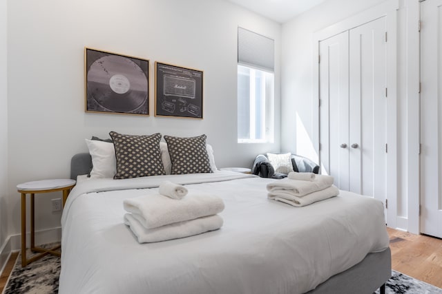 bedroom featuring a closet and hardwood / wood-style flooring