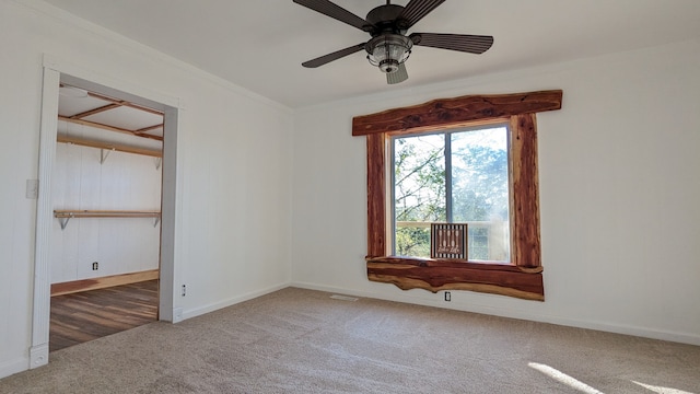 unfurnished room with ceiling fan and carpet floors