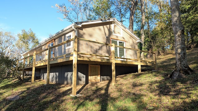 rear view of house with a wooden deck