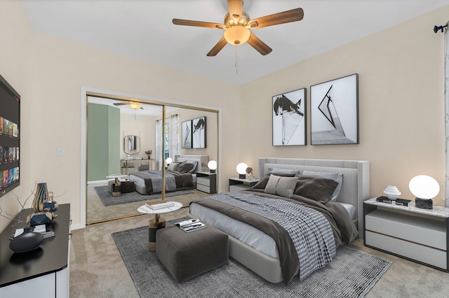 carpeted bedroom with a ceiling fan and a closet