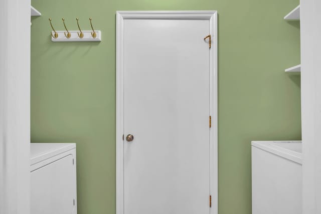 laundry area featuring independent washer and dryer and laundry area