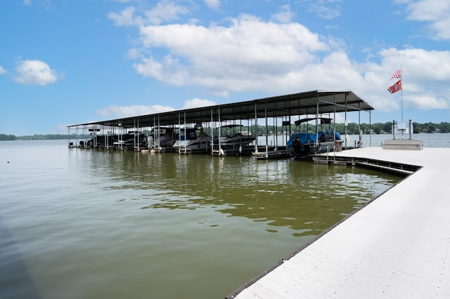 dock area featuring a water view and boat lift