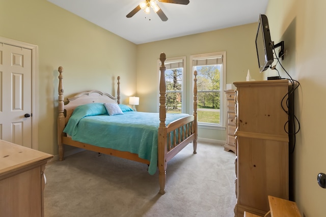 carpeted bedroom with ceiling fan