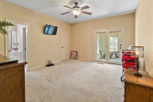 misc room featuring ceiling fan and light colored carpet