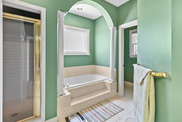 bathroom with ornate columns, tile patterned floors, independent shower and bath, and plenty of natural light