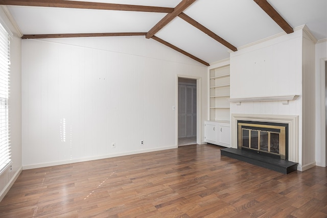 unfurnished living room featuring dark hardwood / wood-style floors and lofted ceiling with beams