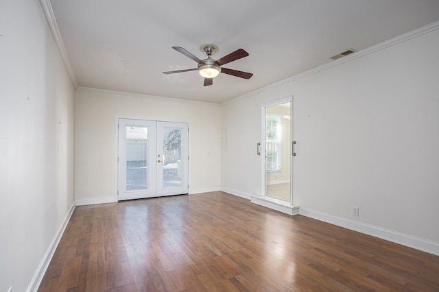 unfurnished room with ornamental molding, ceiling fan, dark wood-type flooring, and french doors