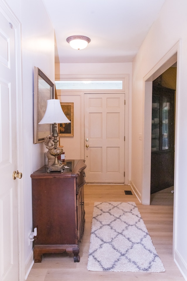 doorway with light hardwood / wood-style floors