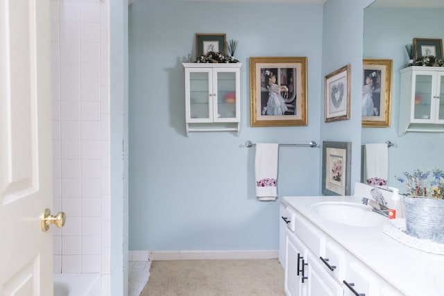 bathroom featuring vanity and a tub