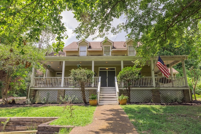 view of front of property with a front lawn and covered porch