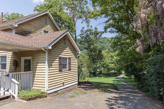 view of home's exterior with a yard