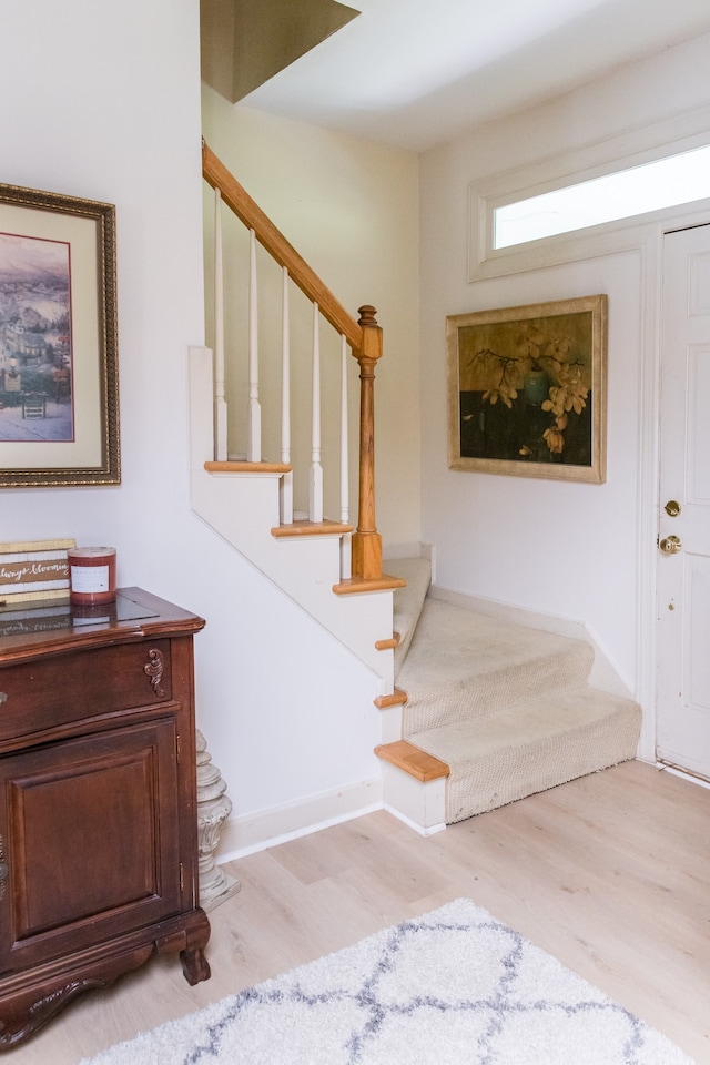 staircase featuring hardwood / wood-style floors