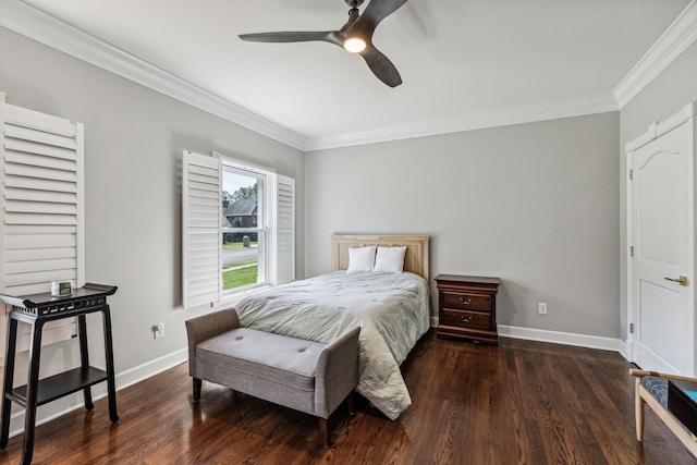 bedroom with ornamental molding, dark wood-type flooring, and ceiling fan