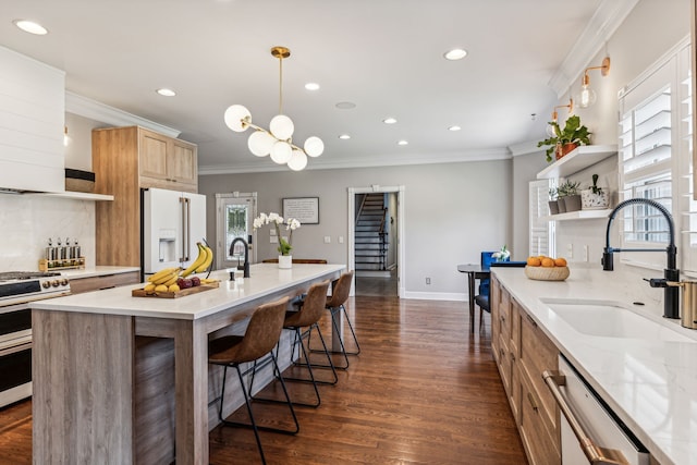 kitchen with range, a healthy amount of sunlight, high end white refrigerator, and dishwasher