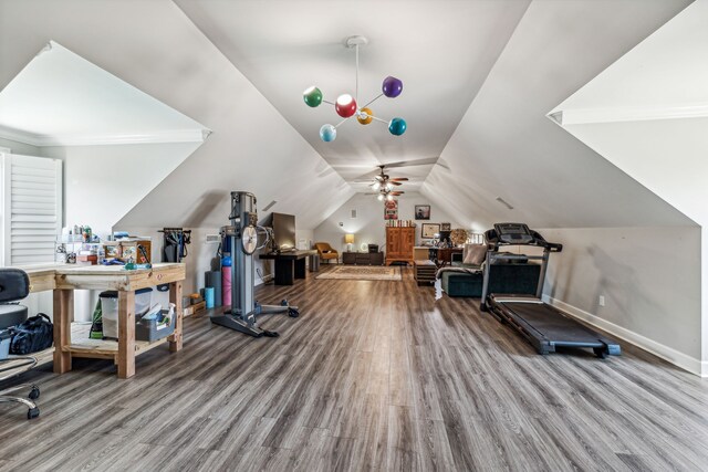 exercise area with lofted ceiling, hardwood / wood-style flooring, and ceiling fan