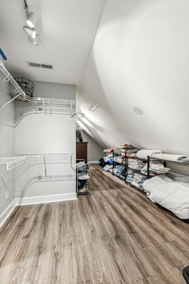 spacious closet featuring hardwood / wood-style flooring