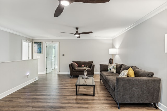 living room with crown molding, ceiling fan, and dark hardwood / wood-style flooring