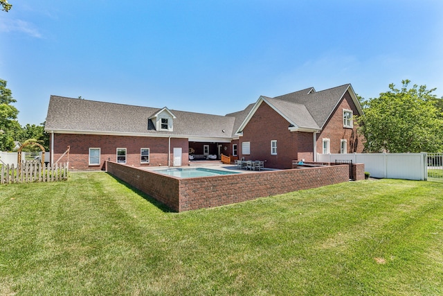 back of house featuring a yard and a patio