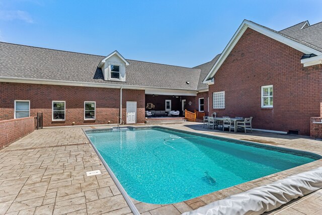 view of pool featuring a patio