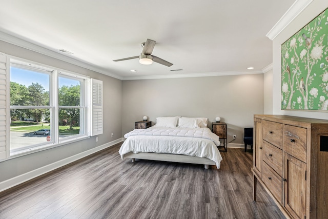 bedroom with ornamental molding, dark hardwood / wood-style floors, and ceiling fan