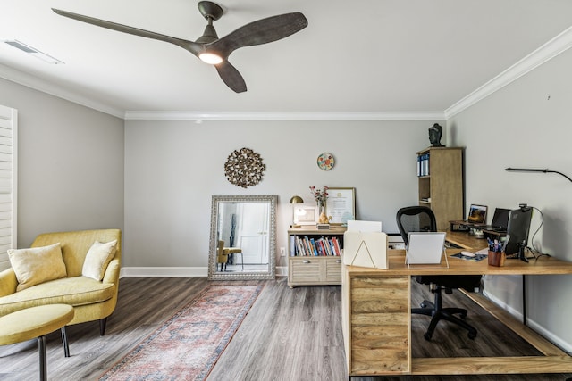 office space with ornamental molding, wood-type flooring, and ceiling fan