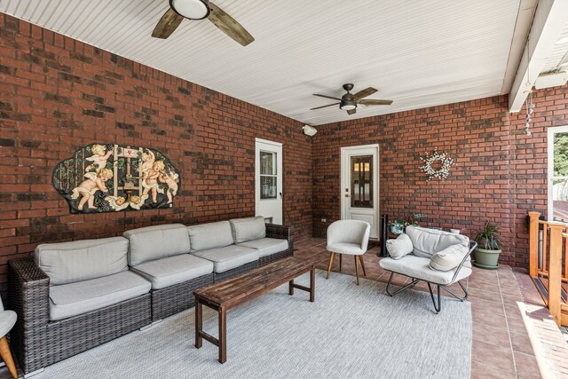 view of patio with ceiling fan and an outdoor living space