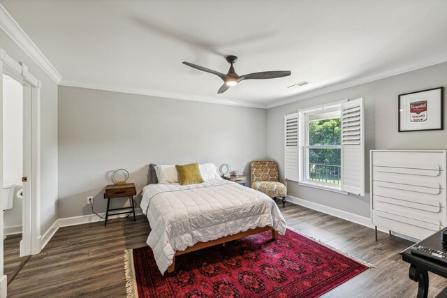 bedroom featuring dark wood-type flooring, ceiling fan, and crown molding