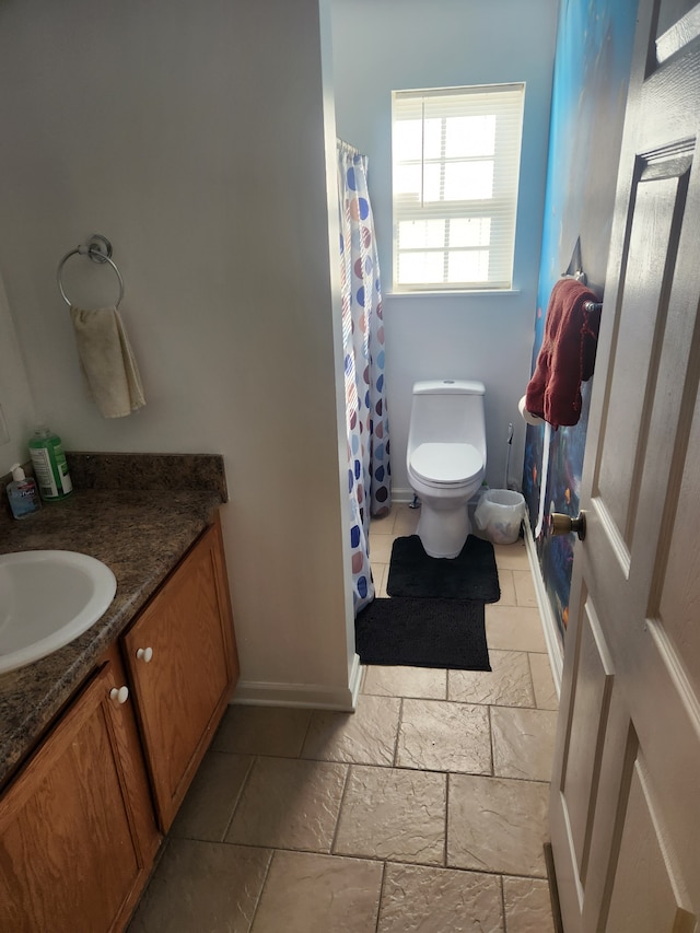 bathroom featuring vanity, toilet, and a shower with curtain